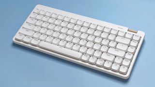 The Lofree Flow Lite mechanical keyboard against a blue background.