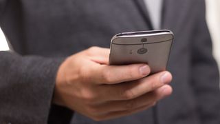 Businessman holding smartphone