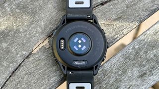 Bottom of the Garmin Forerunner 265, showing charging port and sensors