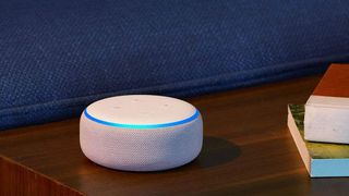 Amazon Echo Dot (3rd generation) in white pictured on a wooden surface