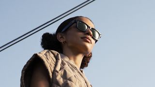 model wearing facebook smart glasses outdoors