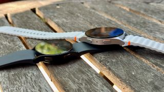 The Samsung Galaxy Watch 6 (left, black) and Samsung Galaxy Watch 7 (right, silver) side-by-side