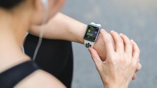 Woman using activity tracking on an Apple Watch