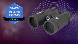 The Celestron TrailSeeker 8x42 binoculars against a backdrop of the night sky, with a rosette that reads Space.com Black Friday deals.