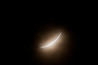 The moon partially covers the sun during a total solar eclipse, as seen from Eagle Pass, Texas