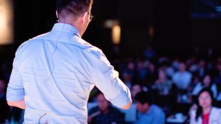 Man speaking in front of audience