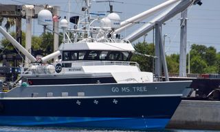 The net-equipped ship GO Ms. Tree returns to port on Thursday (June 27) with a payload fairing on deck.