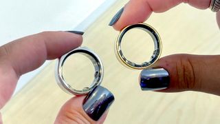 Person holding the Samsung Galaxy Ring in silver and gold