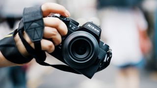 Nikon Z50 II mirrorless camera in the hand