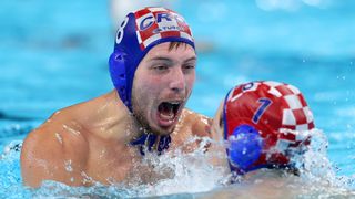  Marko Zuvela and Marko Bijac of Team Croatia celebrate Croatia's victory ahead of the men's water polo final at the 2024 Paris Olympic Games.