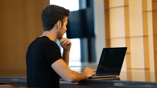 Man using a laptop in office