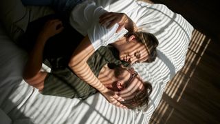 couple in bed hugging