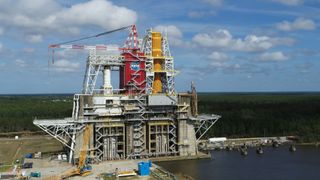 The first flight core stage of NASA's new Space Launch System (SLS) is seen here, installed on the B-2 Test Stand at NASA's Stennis Space Center in Mississippi. 