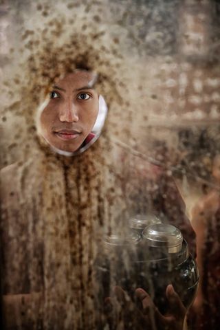 The Burma portrait is shot just as a monk walked past the broken window. Fortunately, he looked through the window - you need luck once in a while