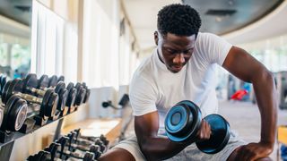 Resistance bands vs weights: image shows weightlifter