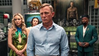 (L - R) Kate Hudson as Birdie, Jessica Henwick as Peg, Daniel Craig as Detective Benoit Blanc, and Leslie Odom Jr. as Lionel in 'Glass Onion: A Knives Out Mystery'