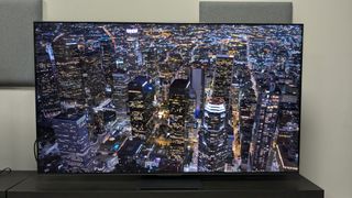 TCL C855 with shot of city at night from the sky