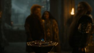 A screenshot of Prince Durin, Disa, and Narvi looking at the dwarf rings in The Rings of Power season 2's final episode