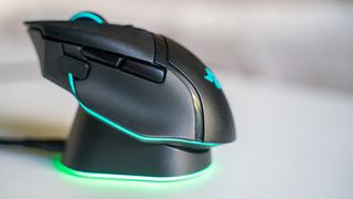 Razer Basilisk V3 Pro with Mouse Dock Pro on a white table