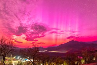 A bright pink sky over Hulunbuir city in China.