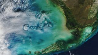 A satellite image of hole in the cloud above the ocean of Florida's west coast