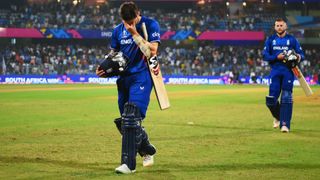 Mark Wood (L) walks off with his head in his hands ahead of the England vs Sri Lanka live stream from the Cricket World Cup