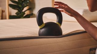 We test the edge support of the Nolah Natural 11 Mattress using a kettlebell