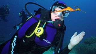 Dr. Sylvia Earle underwater in scuba gear.