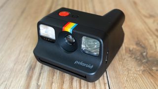 Polaroid Go 2 Polaroid Go 2 on a wooden floor