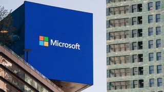 Logo and branding of Windows Server developer Microsoft pictured on a digital billboard in New York City, USA. 