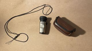 monocular and accessories on a table