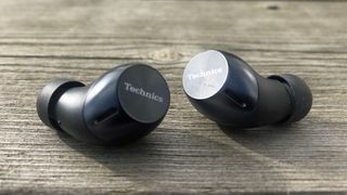 a closeup of the technics eah-az40 wireless earbuds