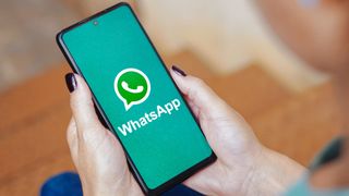 In this photo illustration, the WhatsApp logo is displayed on a smartphone screen.