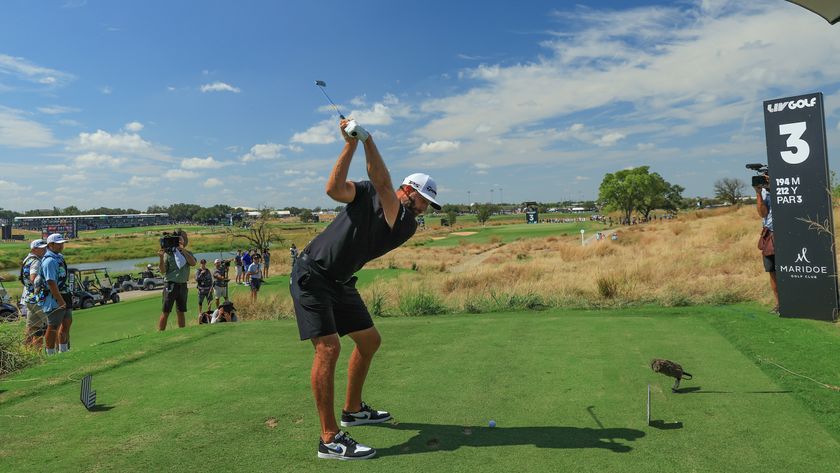 Dustin Johnson plays a shot during the LIV Golf team championship in 2024