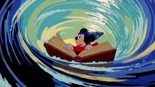 Mickey Mouse wearing a wizard's outfit and grabbing a giant book while waves swirl around him during the Disney movie Fantasia.