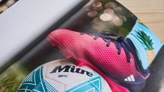 Shutterfly Photo Book displaying boot on top of football