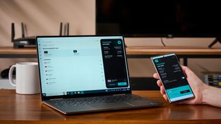 Surfshark VPN apps running on a laptop and mobile during TechRadar's testing