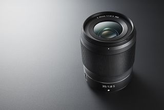 Nikon Z 35mm f/1.8 lens on gray surface