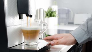 A coffee being brewed using a bean-to-cup coffee machine