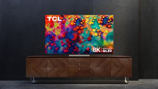 The new TCL 6-Series 8K TV sits on a media cabinet