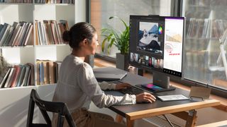 Lenovo&#039;s ThinkCentre Neo 50a and wireless charging stand in situ