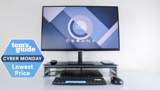 The Anker 675 USB-C Docking Station with a monitor on top, a laptop underneath and a Tom's Guide Cyber Monday deals badge