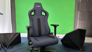 A Boulies Elite Series gaming chair in front of a studio background