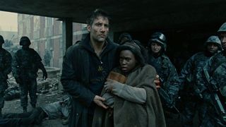 Clive Owen and Clare-Hope Ashitey in Children of Men