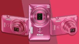 Pink Nikon Coolpix S6900 camera on a pink background