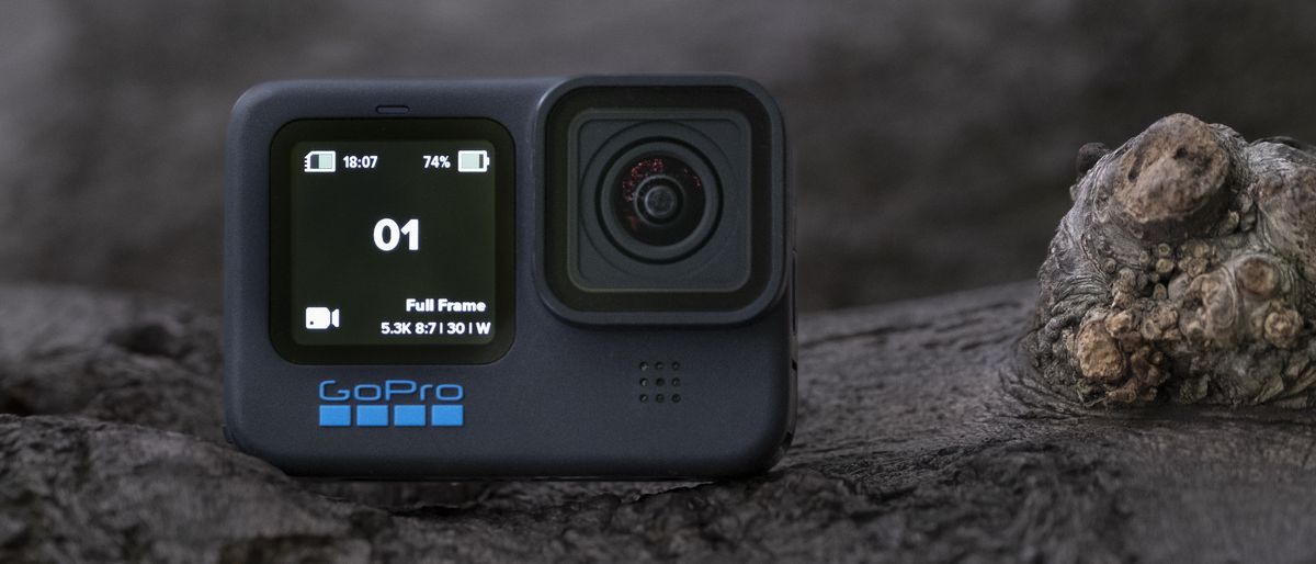 The GoPro Hero 11 Black action camera sitting on a wooden platform