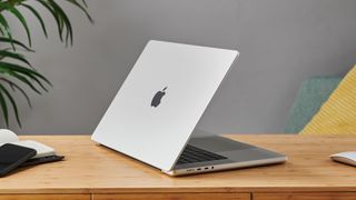 MacBook Pro 16-inch on wooden table in modern office