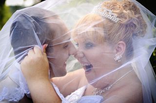 An overweight bride and her husband