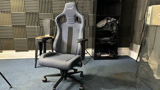 A Boulies Elite Series chair in front of some sound-proofing