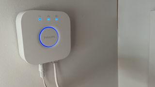 philips hue bridge mounted on wall